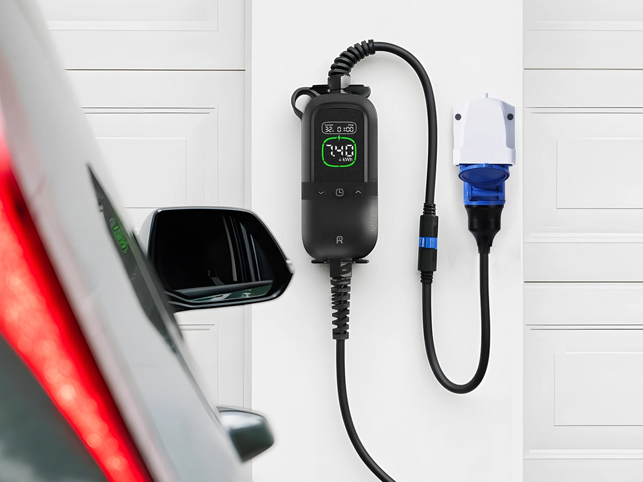 Rheidon PC200 Pro 7K4 portable EV charger plugged into a wall socket, charging an electric vehicle in a garage.